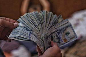 stack of money representing the success of a school fundraiser